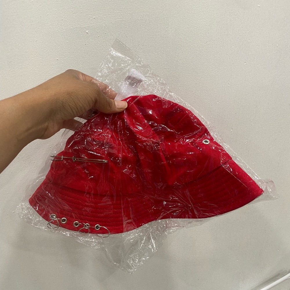 Red bucket hat with pins